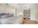 Bright bedroom featuring built-in bookshelves and storage at 33 Bishops Court Rd # 118, Osprey, FL 34229