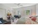 Bright bedroom features plantation shutters, and comfortable furnishings at 33 Bishops Court Rd # 118, Osprey, FL 34229