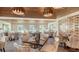 Elegant dining area with stylish seating and modern chandeliers, offering a perfect ambiance for an elevated dining experience at 33 Bishops Court Rd # 118, Osprey, FL 34229