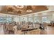 Elegant dining area with stylish seating and modern chandeliers, offering a perfect ambiance for an elevated dining experience at 33 Bishops Court Rd # 118, Osprey, FL 34229