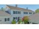 Elegant two-story home with dark shutters and lush landscaping in a well-maintained yard at 33 Bishops Court Rd # 118, Osprey, FL 34229