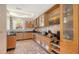 Modern kitchen with stainless steel appliances, granite countertops, and ample cabinet space at 33 Bishops Court Rd # 118, Osprey, FL 34229