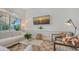 Cozy living room with a comfortable seating area and a large wall-mounted television at 33 Bishops Court Rd # 118, Osprey, FL 34229