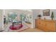 A view of the dining and living room area, featuring a wooden hutch at 33 Bishops Court Rd # 118, Osprey, FL 34229