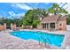 Beautiful community pool with lounge chairs and tables for residents to relax and enjoy at 33 Bishops Court Rd # 118, Osprey, FL 34229