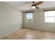 Empty bedroom featuring tile flooring, natural light, and a ceiling fan at 33 S Gulfstream Ave # 502, Sarasota, FL 34236