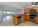 Kitchen featuring wooden cabinets and stainless-steel appliances with an eat-in bar at 33 S Gulfstream Ave # 502, Sarasota, FL 34236