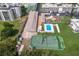 Aerial view of a tennis court and pool that the condo community offers to its residents at 3320 Gulf Of Mexico Dr # 307C, Longboat Key, FL 34228