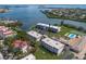 Beautiful aerial view of the condo community on the water with pool and tennis courts for recreation at 3320 Gulf Of Mexico Dr # 307C, Longboat Key, FL 34228