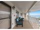 A balcony sitting area with chairs and an ocean view for relaxation and outdoor enjoyment at 3320 Gulf Of Mexico Dr # 307C, Longboat Key, FL 34228