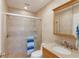 Updated bathroom featuring tiled walk-in shower, granite vanity, and modern fixtures at 3320 Gulf Of Mexico Dr # 307C, Longboat Key, FL 34228