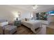 Cozy bedroom boasts a comfortable armchair, a soft bed, and charming blue accents throughout at 3320 Gulf Of Mexico Dr # 307C, Longboat Key, FL 34228