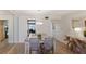 Dining room with modern decor, stylish furniture, open floor plan and tile floors at 3320 Gulf Of Mexico Dr # 307C, Longboat Key, FL 34228