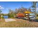 Picture of the kayak storage rack with lake and trees in the background on a sunny day at 3320 Gulf Of Mexico Dr # 307C, Longboat Key, FL 34228