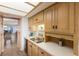 Bright kitchen features wood cabinets, modern appliances, and an open design connecting to the dining area at 3320 Gulf Of Mexico Dr # 307C, Longboat Key, FL 34228