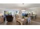 Bright living room with comfortable seating, stylish decor, dining table and lots of natural light at 3320 Gulf Of Mexico Dr # 307C, Longboat Key, FL 34228