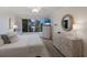 Serene main bedroom offers natural light, decorative furnishings, and a ceiling fan for added comfort at 3320 Gulf Of Mexico Dr # 307C, Longboat Key, FL 34228