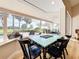 Bright dining area with large windows offering views of the pool and outdoor landscape at 3362 Charles Macdonald Dr, Sarasota, FL 34240