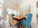 Open dining room with chandelier lighting, and views to the outdoor area at 3362 Charles Macdonald Dr, Sarasota, FL 34240