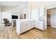 Open-concept kitchen with modern white cabinets, adjacent to the living area at 3362 Charles Macdonald Dr, Sarasota, FL 34240