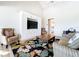 Cozy living room features built-in cabinets, comfortable seating, and a vibrant floral rug at 3362 Charles Macdonald Dr, Sarasota, FL 34240