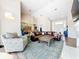 Open living room with vaulted ceiling, and views to the dining room at 3362 Charles Macdonald Dr, Sarasota, FL 34240