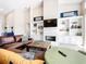 Bright and airy living room with vaulted ceiling, fireplace and views to the backyard at 3362 Charles Macdonald Dr, Sarasota, FL 34240