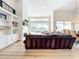 Bright living room with vaulted ceilings, built in shelving, and large sliding glass doors to the outdoor area at 3362 Charles Macdonald Dr, Sarasota, FL 34240