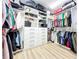 Large walk-in closet with lots of hanging space, shelves, and storage at 3362 Charles Macdonald Dr, Sarasota, FL 34240