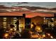 Stunning twilight aerial view of community with ample parking and well-maintained buildings at 3740 Lake Bayshore Dr # 501, Bradenton, FL 34205