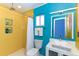 Bathroom featuring a shower, sink, and bright blue and yellow colors at 3740 Lake Bayshore Dr # 501, Bradenton, FL 34205