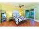 Bright bedroom with a king bed and slider to a Florida room at 3740 Lake Bayshore Dr # Bldg K, Bradenton, FL 34205