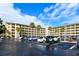 Apartment building featuring palm trees in the parking lot at 3740 Lake Bayshore Dr # 501, Bradenton, FL 34205