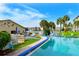 Inviting community pool area with ample seating and beautiful landscaping at 3740 Lake Bayshore Dr # 501, Bradenton, FL 34205
