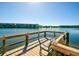 Relaxing dock view overlooking the serene lake, with chairs for enjoying the waterfront scenery at 3740 Lake Bayshore Dr # 501, Bradenton, FL 34205