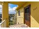 Condo 501's front door with yellow walls, overlooking the property at 3740 Lake Bayshore Dr # 501, Bradenton, FL 34205