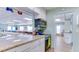 Modern kitchen with granite countertops and appliances with a view to the community room at 3740 Lake Bayshore Dr # 501, Bradenton, FL 34205