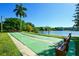 Beautifully landscaped shuffleboard courts with lakeside views at 3740 Lake Bayshore Dr # 501, Bradenton, FL 34205