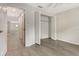 Bedroom featuring gray wood-look flooring and a closet with folding doors at 383 Bobby Jones Rd # 383, Sarasota, FL 34232