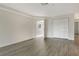 Spacious bedroom with laminate flooring, a double closet and an exit door at 383 Bobby Jones Rd # 383, Sarasota, FL 34232