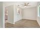 This dining room features wood floors, ceiling fan, and view into the kitchen at 383 Bobby Jones Rd # 383, Sarasota, FL 34232