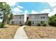 Beautiful two-story building with well-maintained landscaping and inviting walkway at 383 Bobby Jones Rd # 383, Sarasota, FL 34232