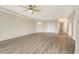 Bright living room featuring wood floors, a ceiling fan and a white front door and closet at 383 Bobby Jones Rd # 383, Sarasota, FL 34232