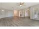 Inviting living room with laminate flooring, natural light, and multiple closets for storage at 383 Bobby Jones Rd # 383, Sarasota, FL 34232