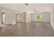 Expansive living room boasts laminate flooring, natural light, and ceiling fan at 383 Bobby Jones Rd # 383, Sarasota, FL 34232