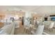 Open floor plan showcasing the living, dining, and kitchen areas with seamless flow and natural light at 385 N Point Rd # 503, Osprey, FL 34229
