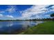 Picturesque pond view surrounded by lush greenery, creating a serene and tranquil setting at 385 N Point Rd # 503, Osprey, FL 34229