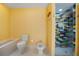 Modern bathroom featuring colorful tiled shower, toilet, bidet, and clean design elements at 3936 Spyglass Hill Rd, Sarasota, FL 34238