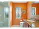 Bathroom featuring a granite vanity, framed mirror, and a glass-enclosed shower at 3936 Spyglass Hill Rd, Sarasota, FL 34238