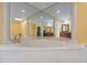 Bright bathroom highlighting a large soaking tub with marble surround and elegant fixtures and large mirrors at 3936 Spyglass Hill Rd, Sarasota, FL 34238